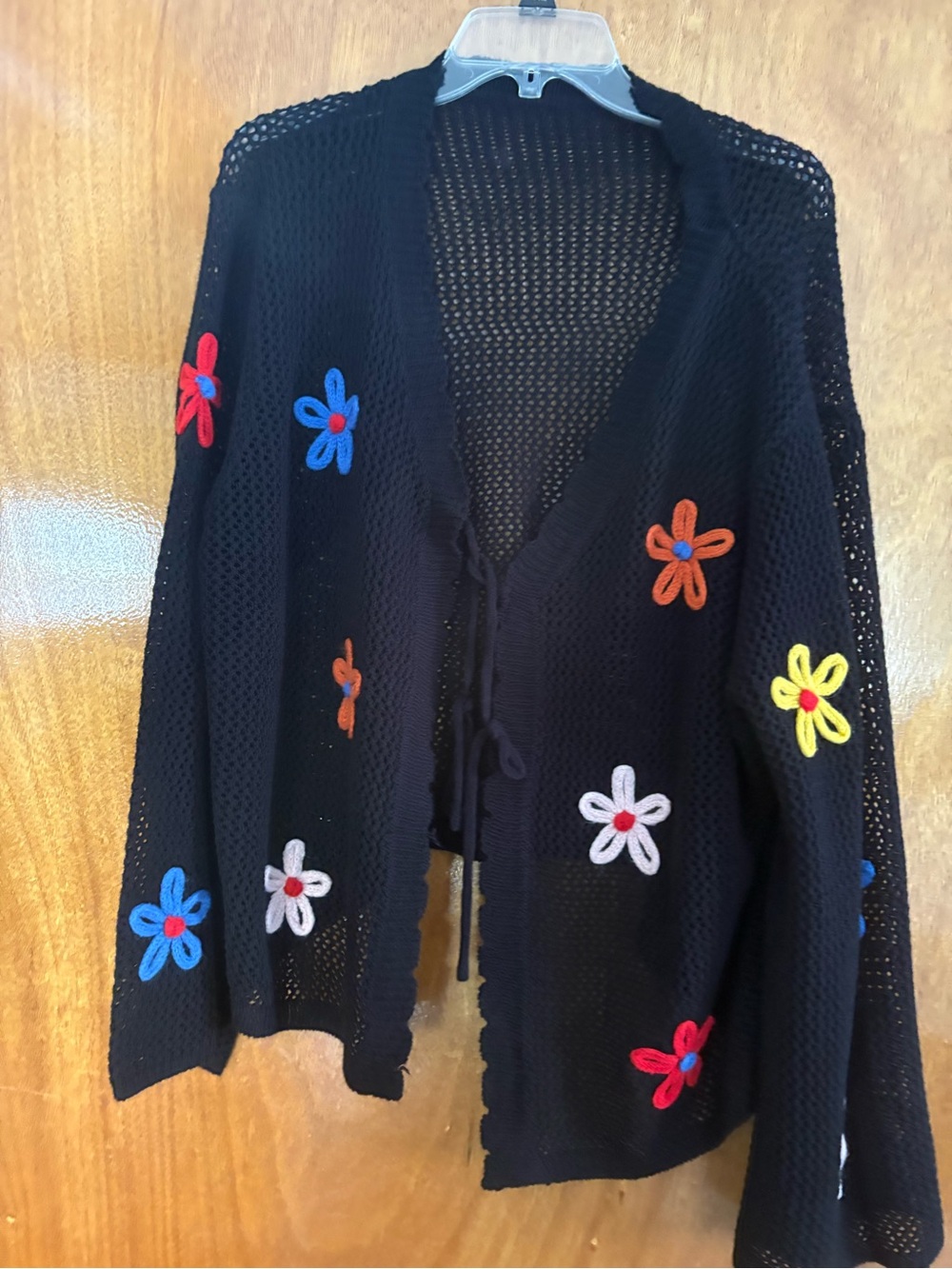 BloomChic Black Open-Knit Cardigan with Multicolor Floral Appliqués